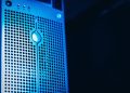 Modern server rack with blue lighting in a secure data center environment.