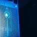 Modern server rack with blue lighting in a secure data center environment.